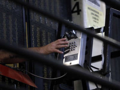 An incarcerated person makes a phone call from his cell in East Block of death row at San Quentin State Prison on December 29, 2015, in San Quentin, California.