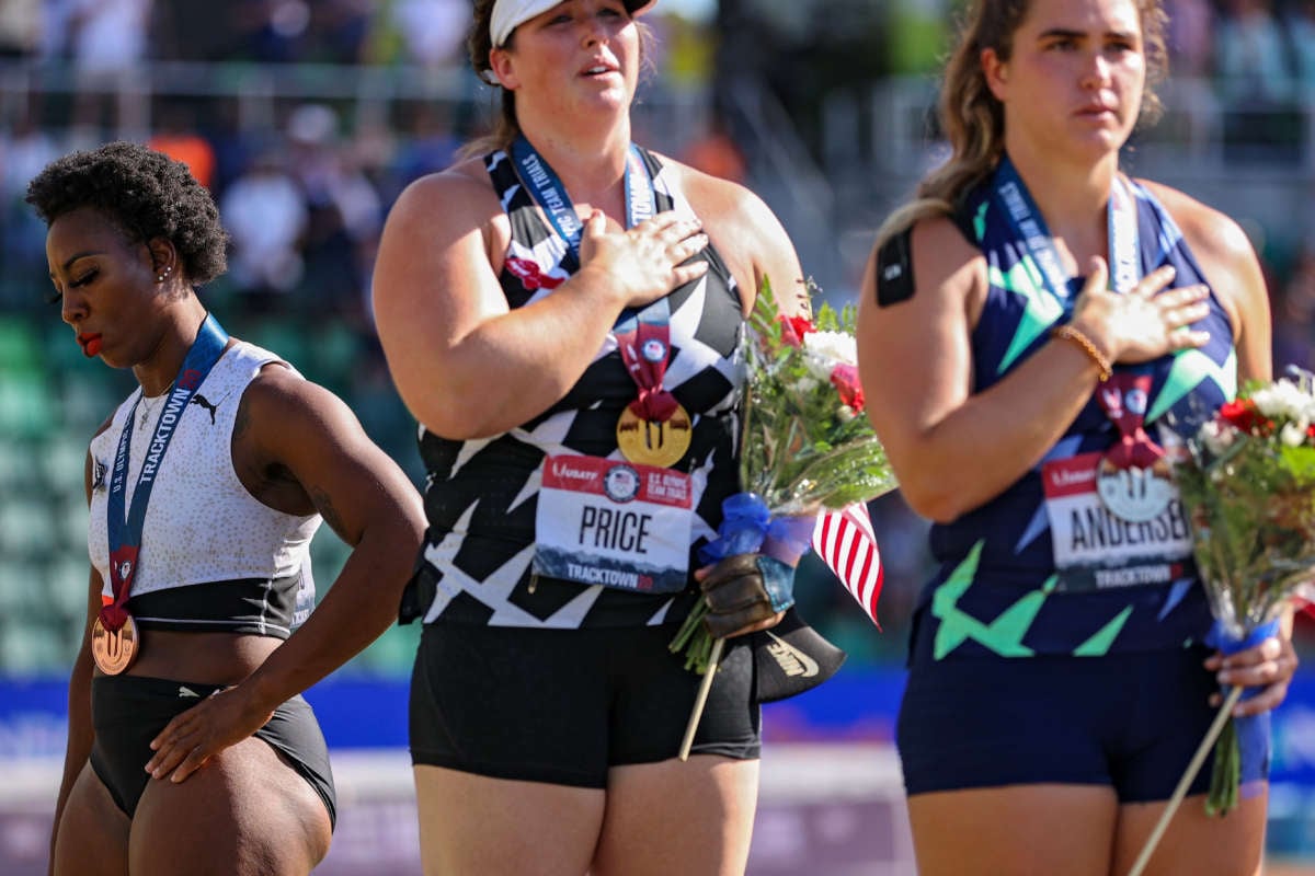 Gwendolyn Berry (left), turns away from U.S. flag during the U.S. national anthem on June 26, 2021 in Eugene, Oregon. In 2019, the USOPC reprimanded Berry after her demonstration on the podium at the Lima Pan American Games.