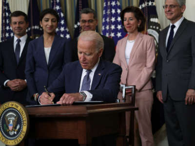 President Joe Biden signs an executive order on “promoting competition in the American economy" at the State Dining Room of the White House on July 9, 2021, in Washington, D.C.