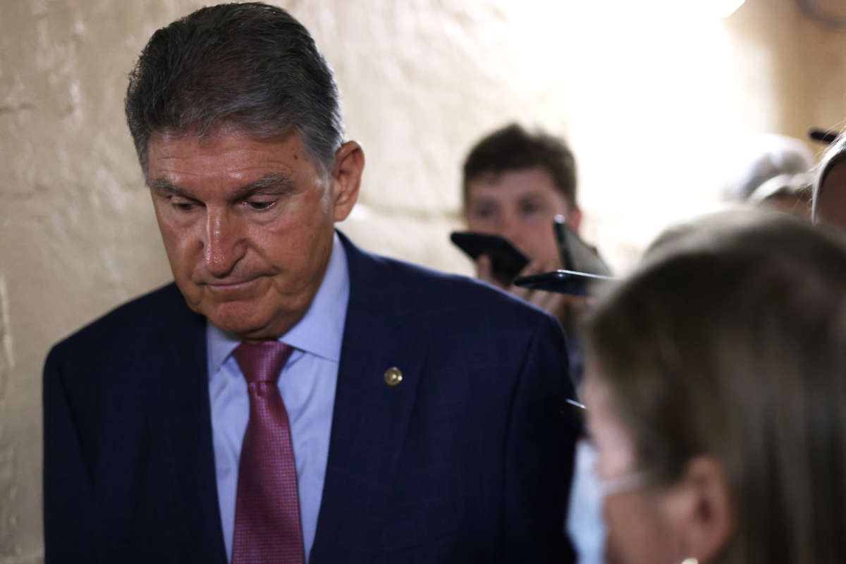 Sen. Joe Manchin talks to reporters as he leaves a meeting with members of Texas House Democratic Caucus at the U.S. Capitol on July 15, 2021, in Washington, D.C.