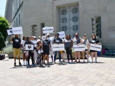 Members of The National Council, Life After Release, Maryland Justice Project and Out for Justice demonstrate outside of the Department of Justice on behalf of Gwendolyn Levi and the more than 4,000 people released under the CARES Act, on June 30, 2021.