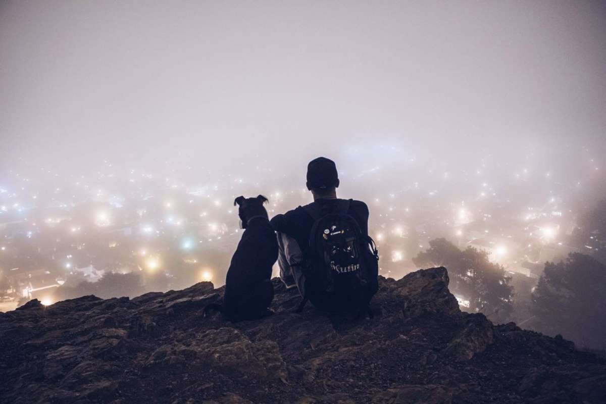 Darik Schaaf sits with his dog, Old Man Reggie.