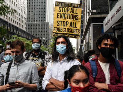 People participate in a protest against N.Y. Governor Andrew Cuomo and protest for a moratorium on evictions on August 4, 2021 in New York City.