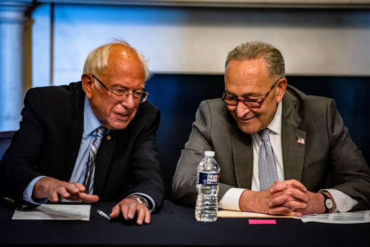 Senate Majority Leader Chuck Schumer (D-New York) and Committee Chairman Bernie Sanders (D-Vermont) holding a meeting with Senate Budget Committee Democrats U.S. Capitol building on June 16, 2021.