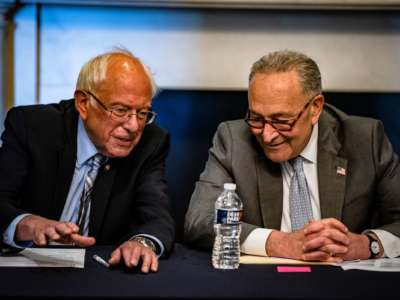 Senate Majority Leader Chuck Schumer (D-New York) and Committee Chairman Bernie Sanders (D-Vermont) holding a meeting with Senate Budget Committee Democrats U.S. Capitol building on June 16, 2021.