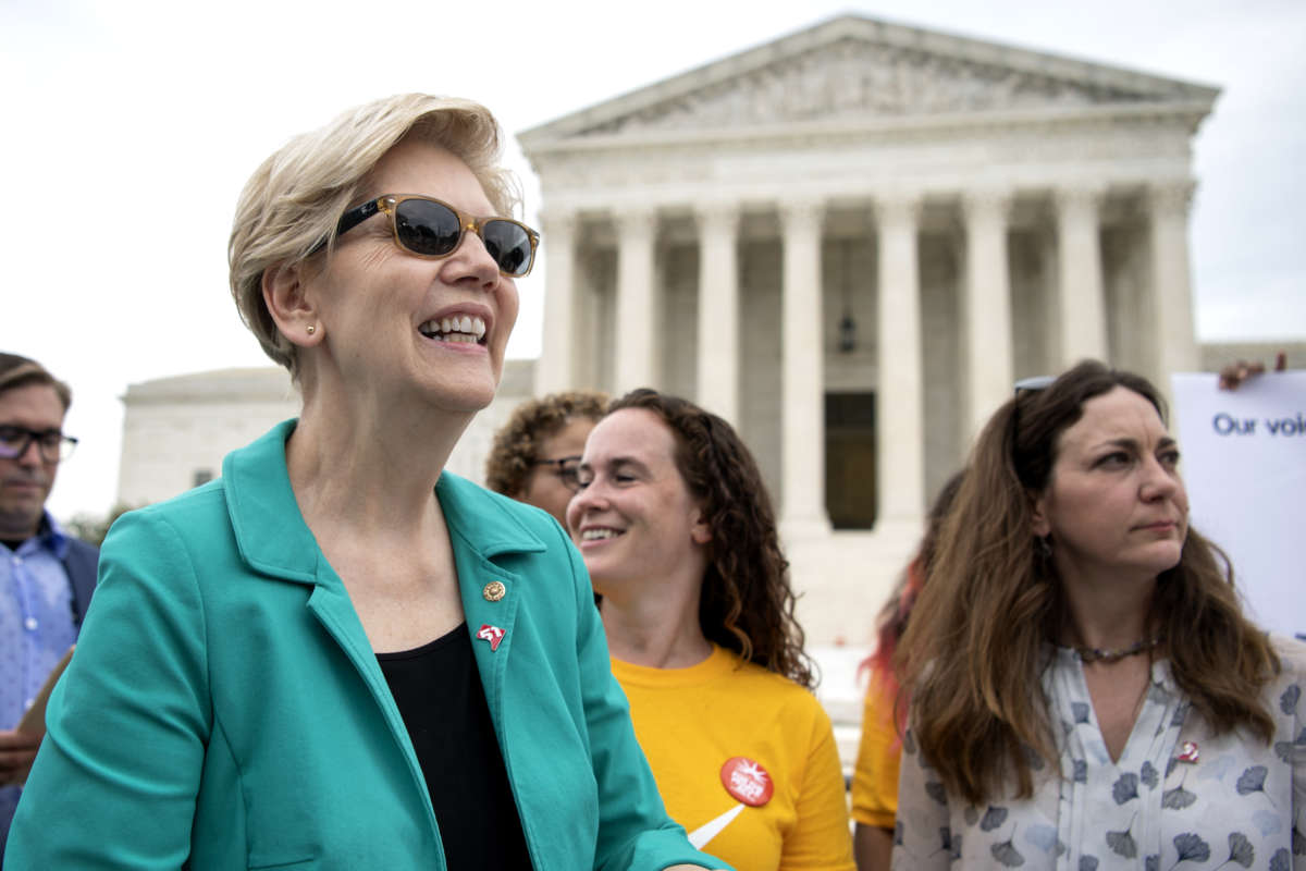 Sen. Elizabeth Warren (D-Massachusetts) attends a rally, hosted by the Declaration for American Democracy coalition, calling on the Senate to pass the For the People Act, outside the Supreme Court in Washington on Wednesday, June 9, 2021.