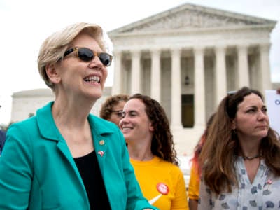 Sen. Elizabeth Warren (D-Massachusetts) attends a rally, hosted by the Declaration for American Democracy coalition, calling on the Senate to pass the For the People Act, outside the Supreme Court in Washington on Wednesday, June 9, 2021.