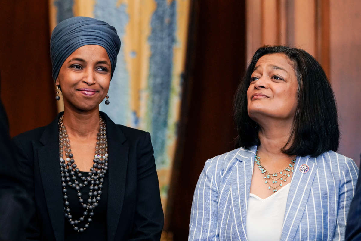 Reps. Omar and Jayapal stand next to eachother