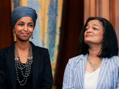 Reps. Omar and Jayapal stand next to eachother