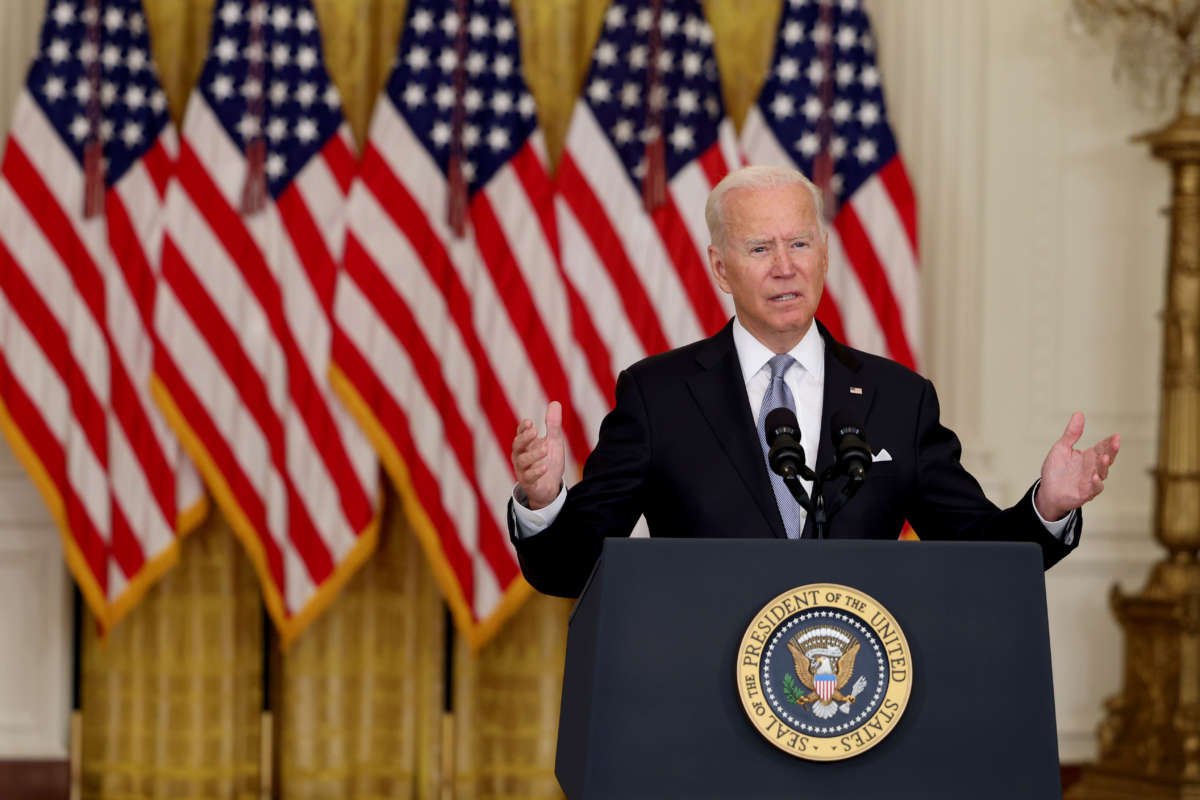 President Joe Biden gestures as he gives remarks in the White House on August 16, 2021.