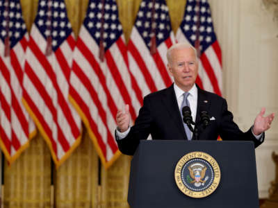 President Joe Biden gestures as he gives remarks in the White House on August 16, 2021.