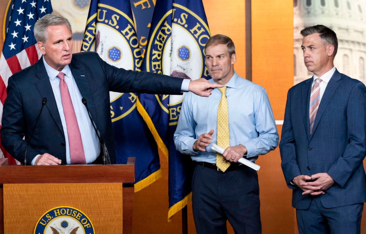 House Minority Leader Kevin McCarthy (R-California), left, speaks as Representatives Jim Jordan (R-Ohio) and Jim Banks (R-Indiana), listen during McCarthy's news conference on Wednesday, July 21, 2021.