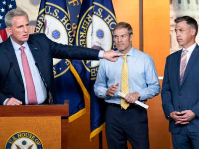 House Minority Leader Kevin McCarthy (R-California), left, speaks as Representatives Jim Jordan (R-Ohio) and Jim Banks (R-Indiana), listen during McCarthy's news conference on Wednesday, July 21, 2021.