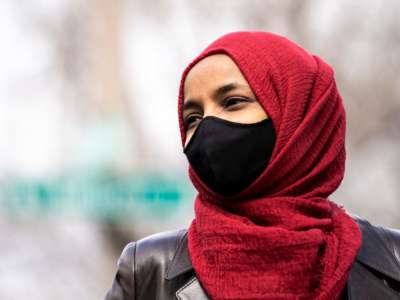 Rep. Ilhan Omar (D-Minnesota) looks on during press a press conference at a memorial site for Daunte Wright in Brooklyn Center, Minnesota on April 20, 2021.