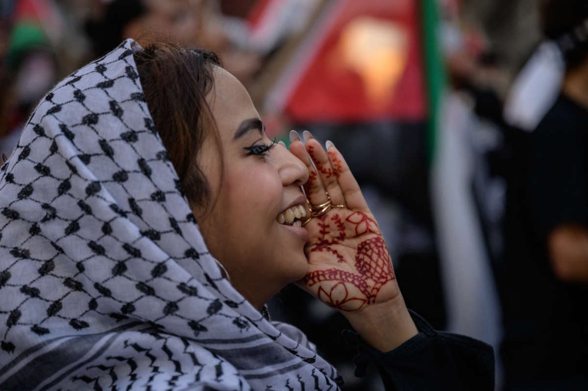 A demonstrator shouts slogans during an emergency rally to defend Palestine in Manhattan, New York, on June 15, 2021.