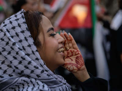 A demonstrator shouts slogans during an emergency rally to defend Palestine in Manhattan, New York, on June 15, 2021.