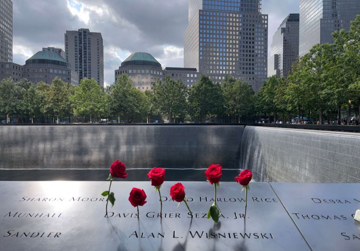 Roses are left in memory of the victims on the 9/11 memorial, in New York City, on July 18, 2021.