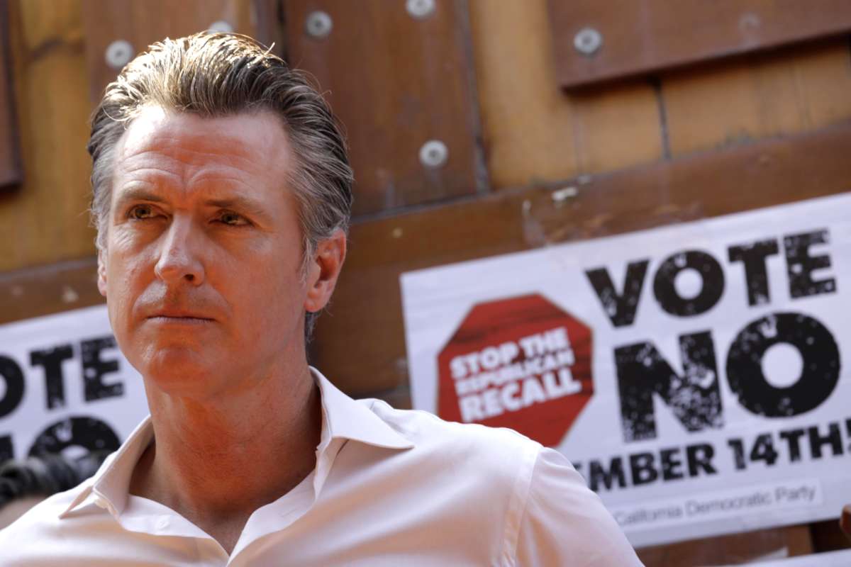 California Gov. Gavin Newsom meets with Latino leaders and volunteers working to call voters and urge them to vote against the recall at Hecho en Mexico restaurant in East Los Angeles on August 14, 2021.