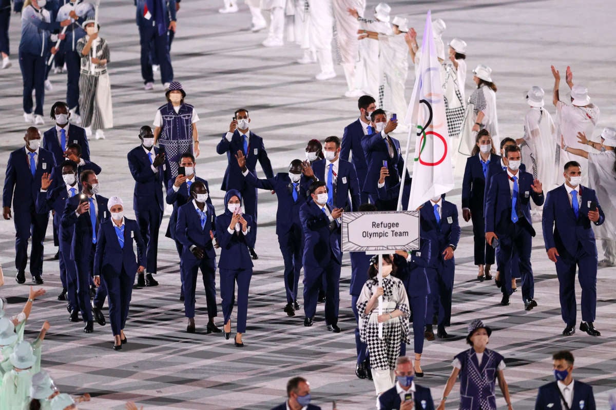 The Refugee Olympic Team walks during the Opening Ceremony of the Tokyo 2020 Olympic Games at Olympic Stadium on July 23, 2021, in Tokyo, Japan.