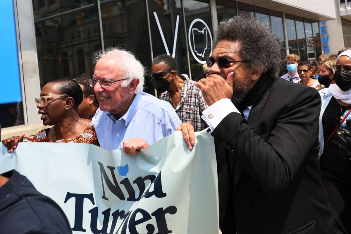 Minnesota Attorney General Keith Ellison, Congressional Candidate Nina Turner, Sen. Bernie Sanders and Dr. Cornel West march with supporters after a Get Out the Vote rally on July 31, 2021, in Cleveland, Ohio.