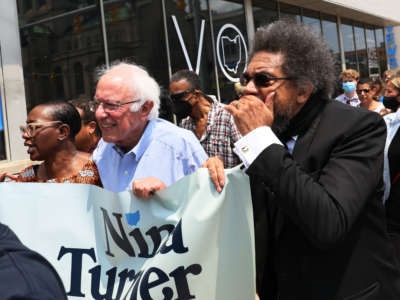 Minnesota Attorney General Keith Ellison, Congressional Candidate Nina Turner, Sen. Bernie Sanders and Dr. Cornel West march with supporters after a Get Out the Vote rally on July 31, 2021, in Cleveland, Ohio.
