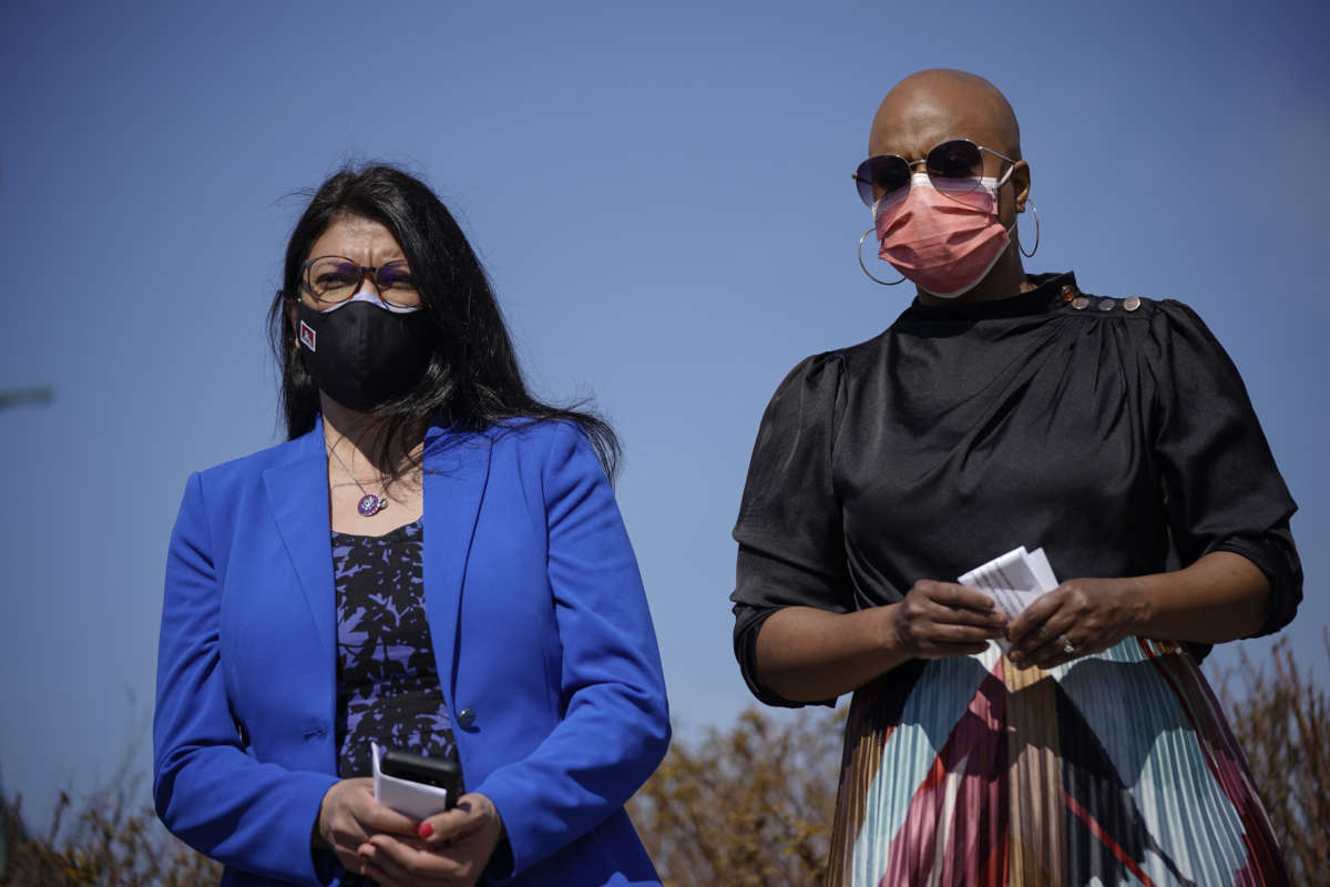 (L-R) Rep. Rashida Tlaib (D-Michigan) and Rep. Ayanna Pressley (D-Massachusetts) attend a news conference outside the U.S. Capitol on March 11, 2021 in Washington, D.C.