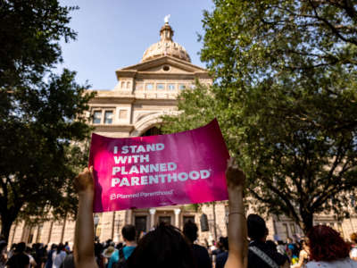 An abortion rights activist holds a sign in support of Planned Parenthood at a rally at the Texas State Capitol on September 11, 2021 in Austin, Texas.