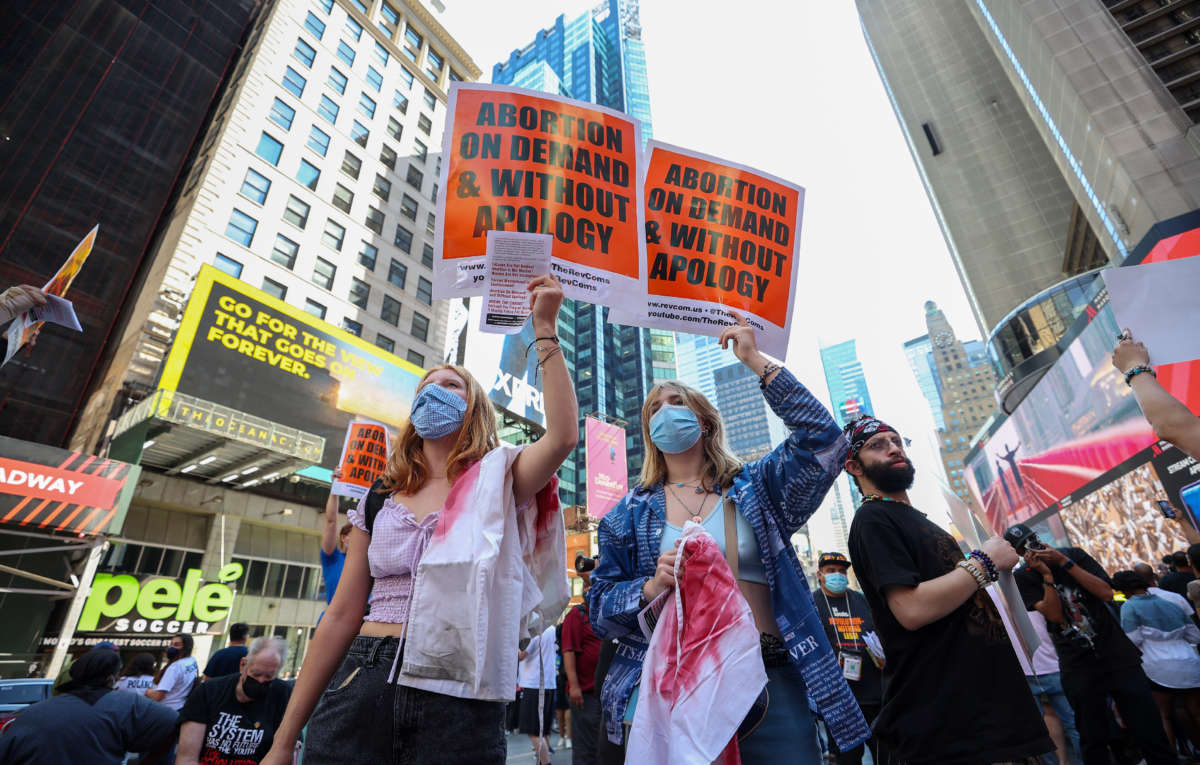 A group of people are gathered at the Times Square of New York City on September 4, 2021, to protest that a Texas law banned abortion.
