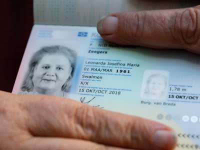 Leonne Zeegers, 57, receives the Netherland's first gender-neutral passport with the gender designation X on October 19, 2018.