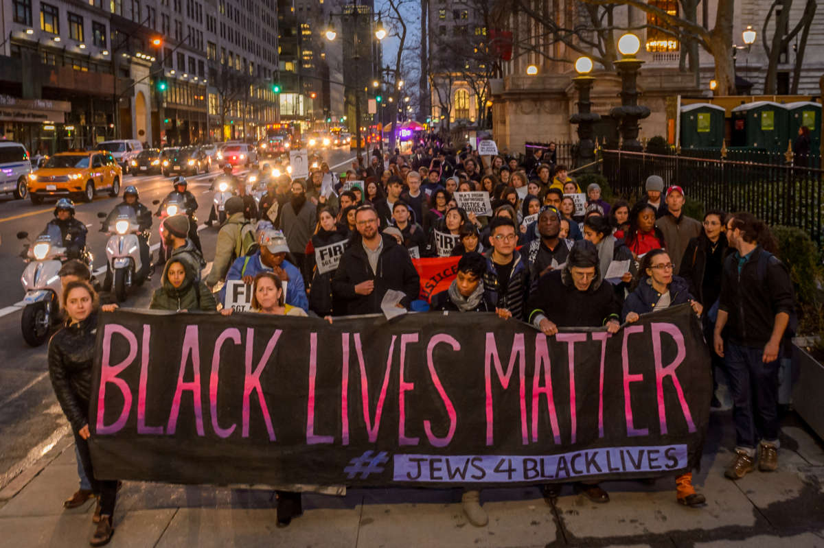 Over a hundred people joined Ramarley Graham's family and other organizations and groups for a public action and vigil in conjunction with Beyond The Moments National Day of Action on April 4, 2017.