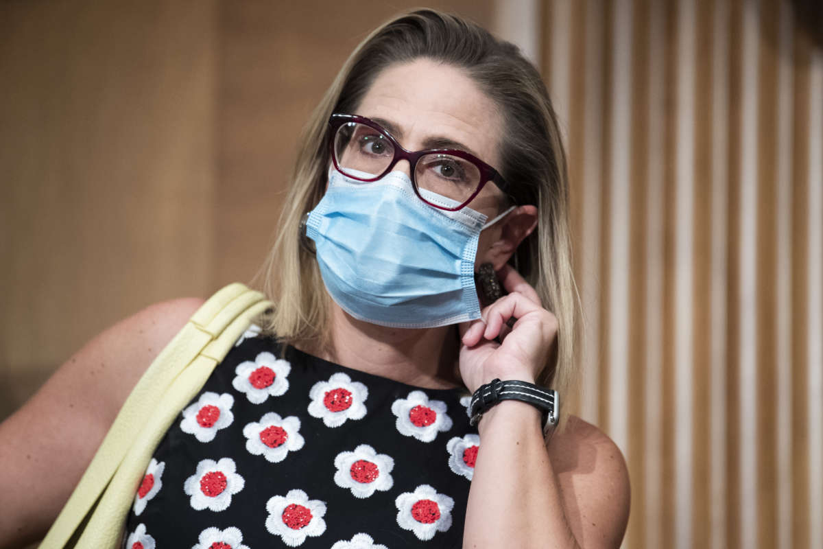 Sen. Kyrsten Sinema is seen during the Senate Homeland Security and Governmental Affairs Committee markup in Dirksen Senate Office Building on August 4, 2021, in Washington, D.C.