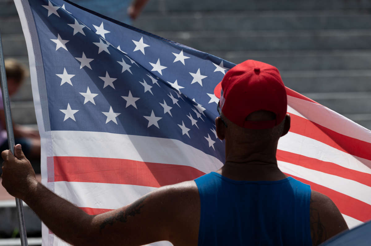 A man displays his U.S. flag during the Kentucky Freedom Rally at the capitol building on August 28, 2021 in Frankfort, Kentucky. Demonstrators gathered to speak out against a litany of issues, including Kentucky Gov. Andy Beshear's management of the coronavirus pandemic, abortion laws and the teaching of critical race theory.
