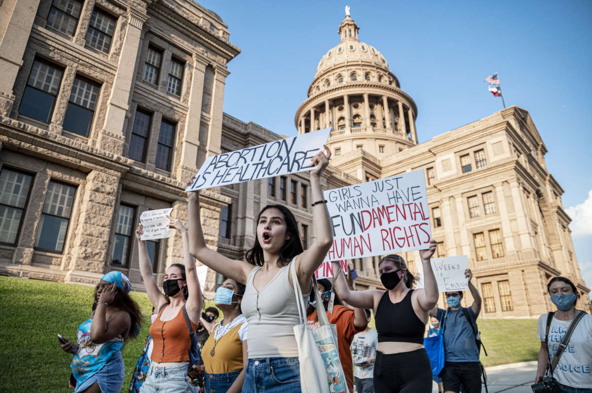 Protesters march outside the Texas State Capitol on September 1, 2021 in Austin, Texas.