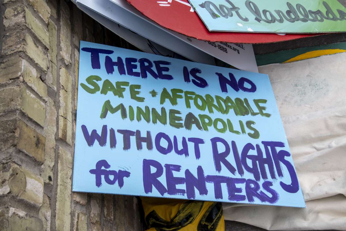 A sign is displayed during a protest against housing evictions during the pandemic in Minneapolis, Minnesota.