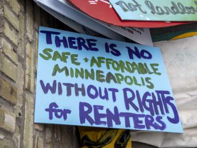 A sign is displayed during a protest against housing evictions during the pandemic in Minneapolis, Minnesota.