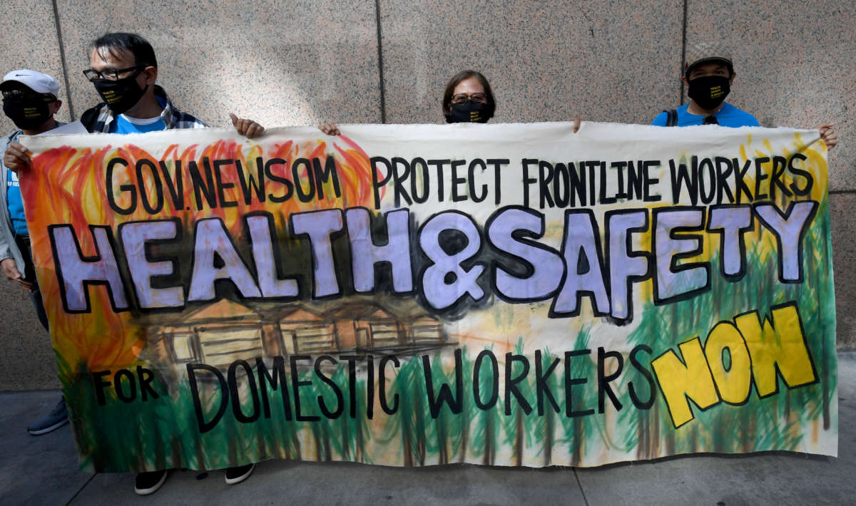 Members of the California Domestic Workers Coalition held a protest to honor frontline workers and amplify their demands for health and safety protections in Los Angeles, California, on May 26, 2021.