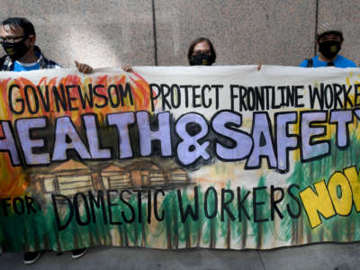 Members of the California Domestic Workers Coalition held a protest to honor frontline workers and amplify their demands for health and safety protections in Los Angeles, California, on May 26, 2021.