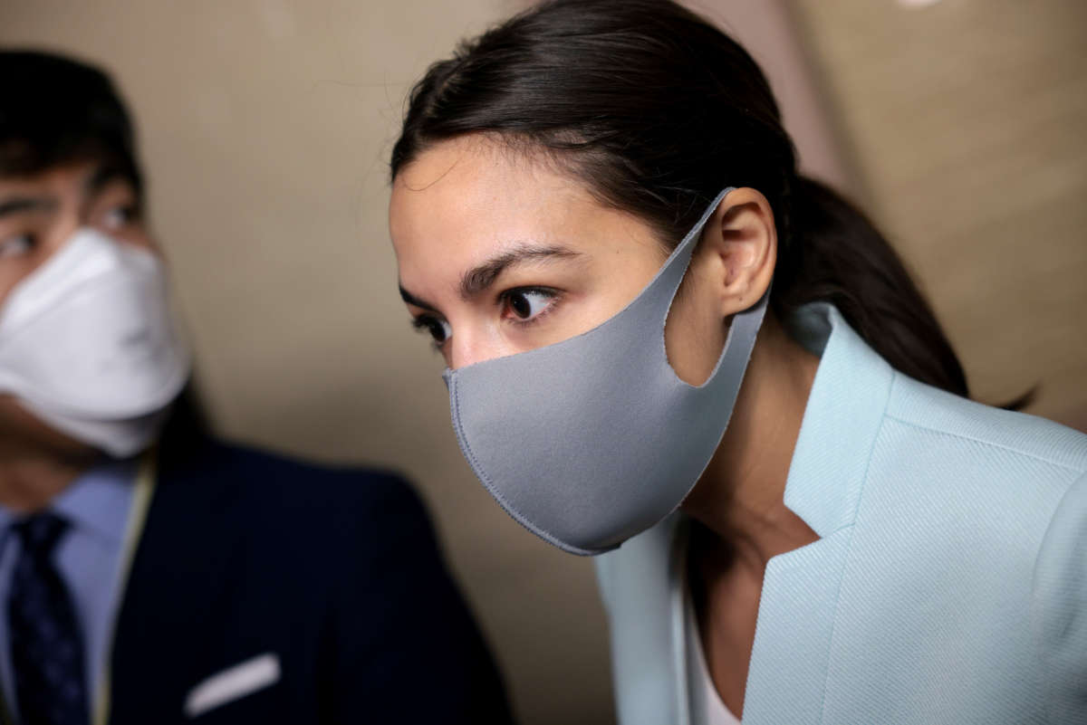 Rep. Alexandria Ocasio-Cortez (D-New York) speaks to reporters before a House Democratic caucus meeting at the U.S. Capitol on October 01, 2021 in Washington, D.C.