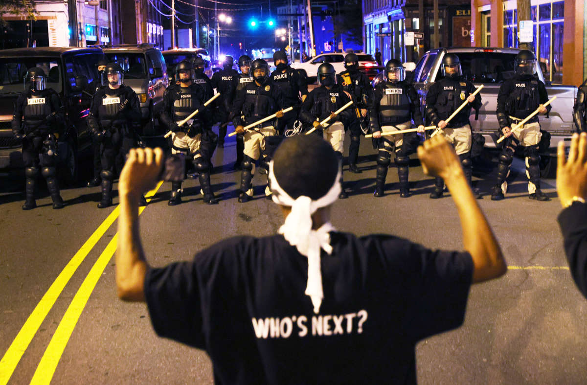 Police in riot gear force people off a street as they protest the killing of Andrew Brown Jr. on April 27, 2021, in Elizabeth City, North Carolina.