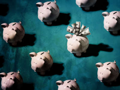 Piggy banks, with only one stuffed with cash