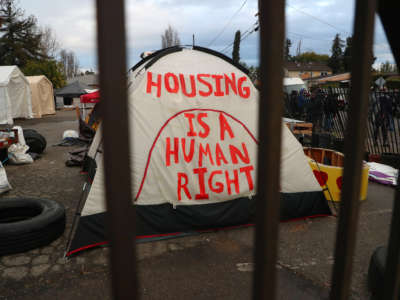 A tent is photographed at a homeless encampment at the corner of Edes and Elmhurst Avenues on December 5, 2018, in Oakland, California.