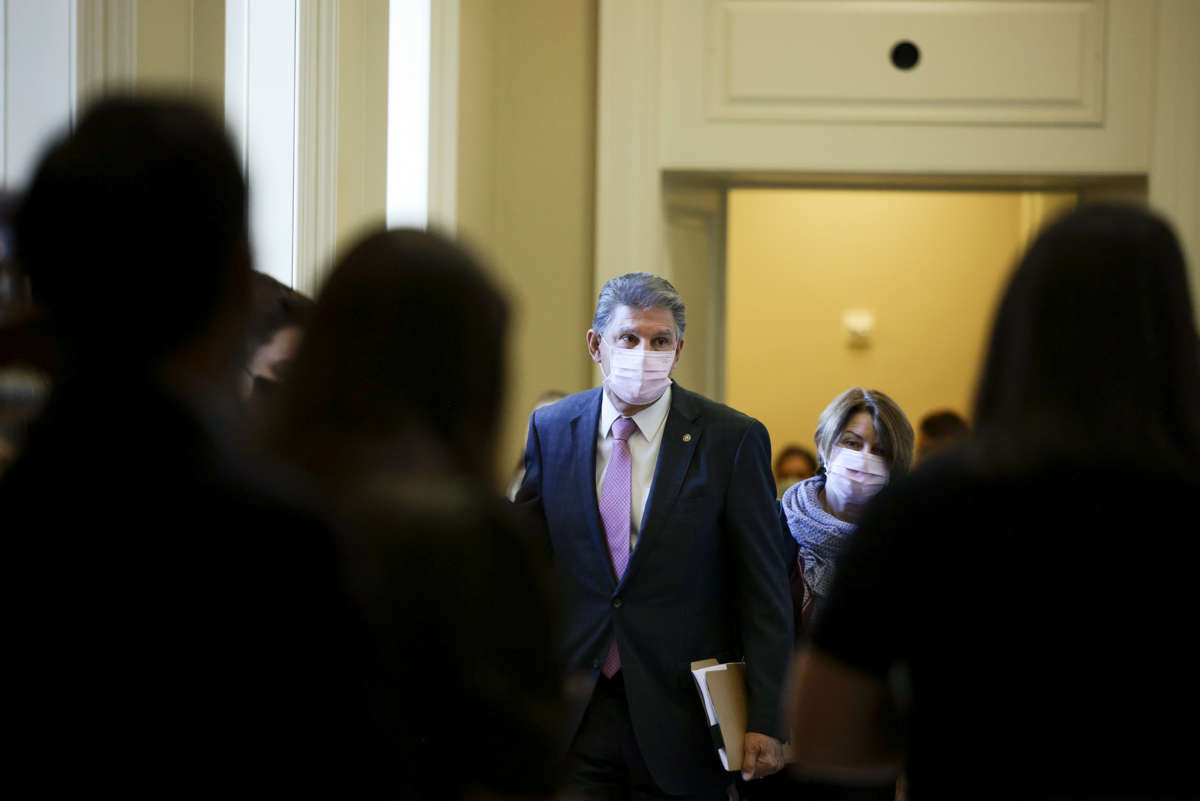 Sen. Joe Manchin leaves a Senate Democrat Luncheon on October 19, 2021, in Washington, D.C.