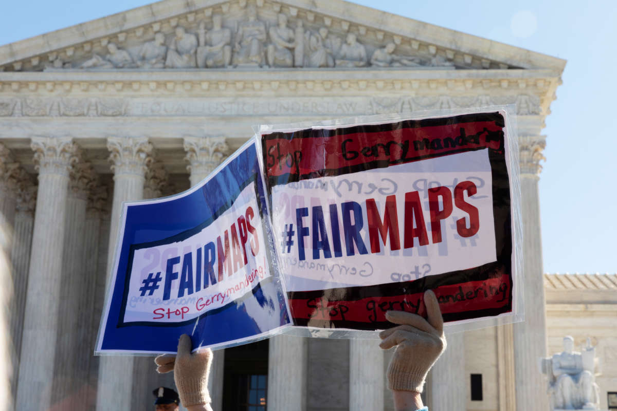 People gather outside the Supreme Court as gerrymandering cases are heard on March 26, 2019.