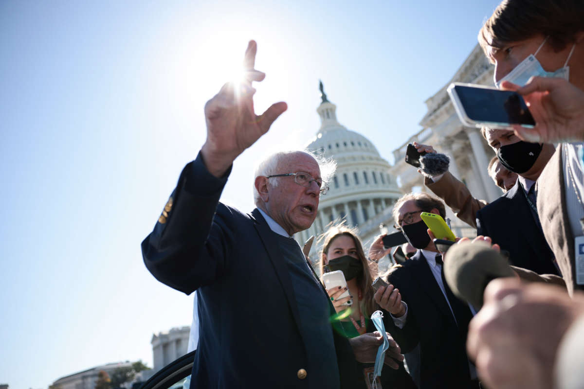Sen. Bernie Sanders speaks with reporters as he leaves the U.S. Capitol Building following a vote on October 21, 2021, in Washington, D.C.
