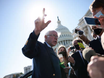 Sen. Bernie Sanders speaks with reporters as he leaves the U.S. Capitol Building following a vote on October 21, 2021, in Washington, D.C.