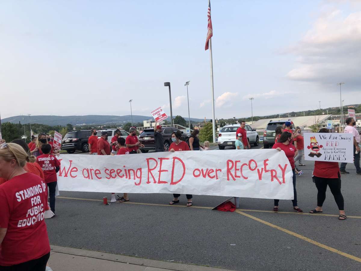 Scranton Educators wear a red shirt for every teacher or paraprofessional who left the Scranton School District in the last year on September 13, 2021.