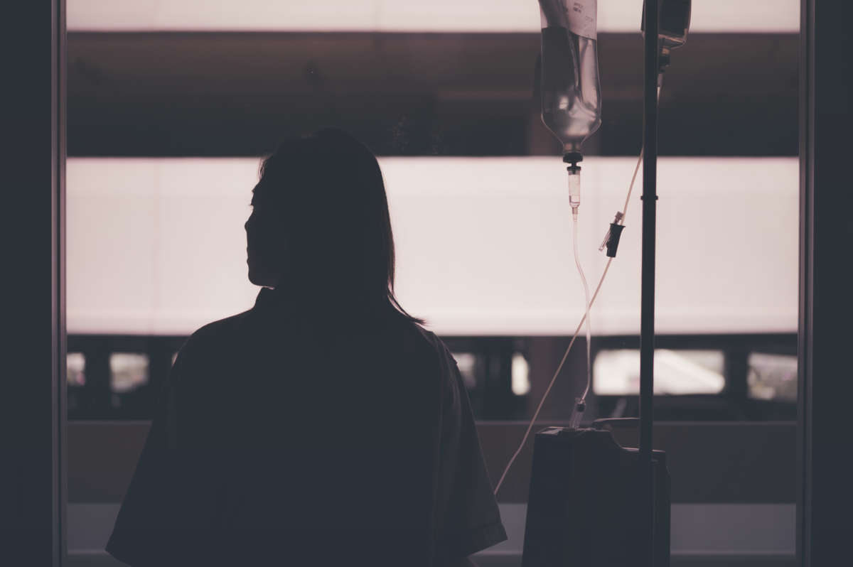 Silhouette of woman patient with IV drip