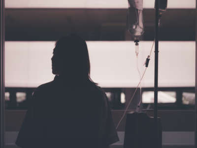 Silhouette of woman patient with IV drip