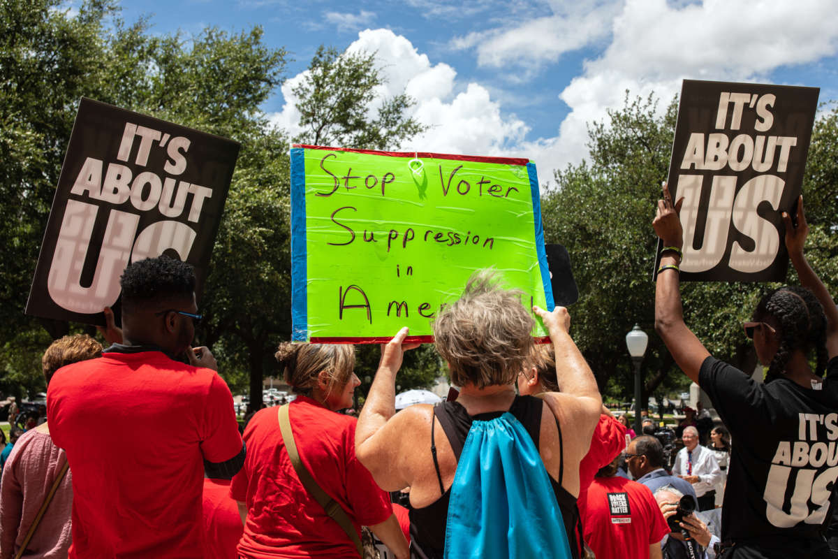 Demonstrators are gathered outside of the Texas State Capitol during a voting rights rally on the first day of the 87th Legislature's special session on July 8, 2021, in Austin, Texas.