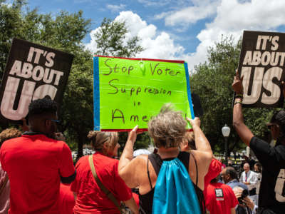 Demonstrators are gathered outside of the Texas State Capitol during a voting rights rally on the first day of the 87th Legislature's special session on July 8, 2021, in Austin, Texas.